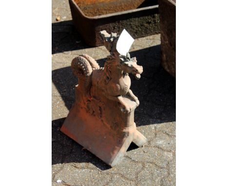 A large ornate terracotta ridge tile finial modelled as dragons