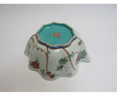 A Chinese leaf shaped bowl decorated with grasshoppers, seal to base, 20cm diameter, 8cm tall 