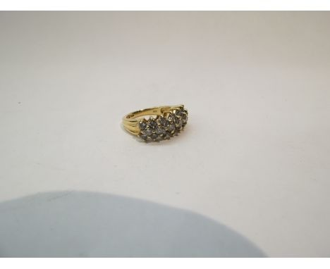 A yellow gold diamond ring, the three rows set with brilliant cut diamonds, size N, 6.7g