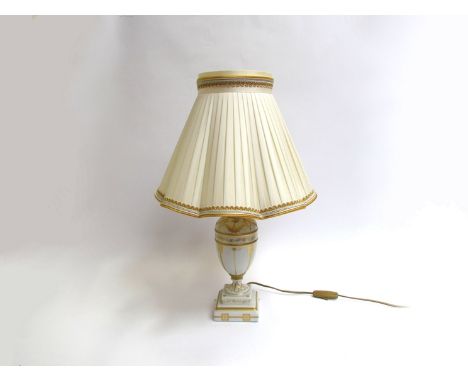 An Italian porcelain table lamp with gilt design and pleated silk shade 