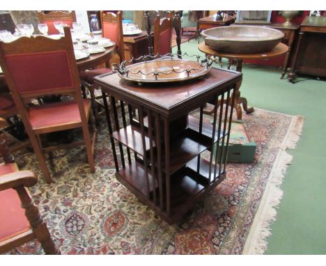 A late Victorian mahogany revolving bookshelf on ceramic castors       