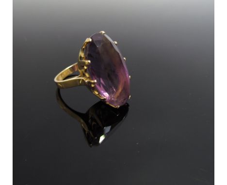 A large oval amethyst set gold ring, size M, 9.4g