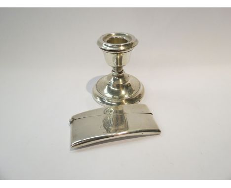A silver ergonomic card case together with a candlestick. Card case weight 45g (2)