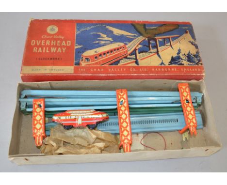 Chad Valley tinplate c/w overhead railway. G in P/F box. Unchecked for completeness