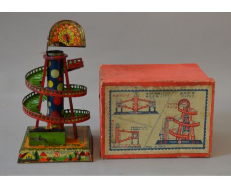 Early Japanese tinplate automatic ball roller helter skelter. Made in Tokyo. F condition, some rusting in F box.