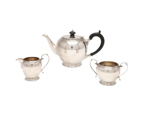 circular form, with incised borders and scroll handles, by Mappin &amp; Webb, Birmingham 1937/38; the tea pot 9.5" (24.3cm) l