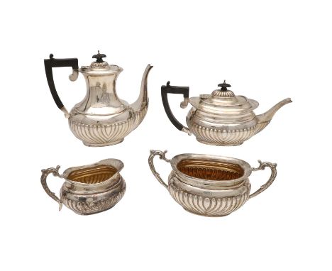 of rounded oblong form, with fluted lower bodies and on flat bases, monogrammed, by E.J Partridge, Birmingham 1904; the coffe