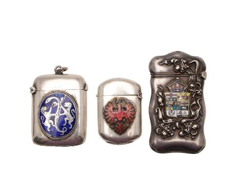 a North American example decorated with floral scrolls and the applied enamel Arms of Canada, a vesta with an applied enamel 