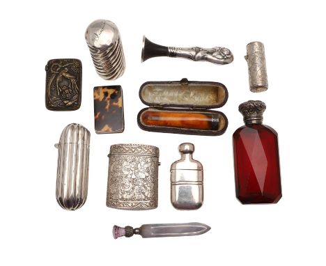 to include 3 silver mounted scent bottles, a cased cheroot holder, a Far-Eastern silver vesta case, an oriental brass vesta c