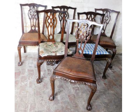 A set of six Chippendale style mahogany dining chairs, each with upholstered seat in varying material.