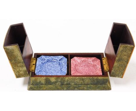 A shagreen smoker's box and contents, comprising Royal Worcester mottled ashtrays, in pink and blue, 7cm x 7cm, the case 6cm 