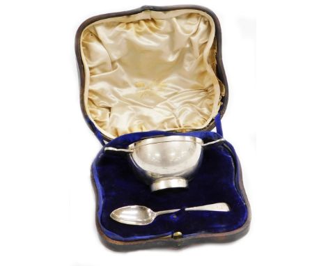 An Edwardian silver loving cup in Celtic style, the inscribed bowl presented to George Anthony Ratcliff Fillingham from his l
