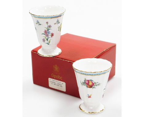 A pair of Spode Trapnell pattern vases, each with gilt border on a turquoise ground with fruits and flowers, 10cm high. 