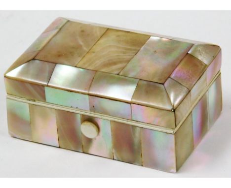 A mother of pearl inlaid trinket box, rectangular with three sectional top and a cream lined interior, 7cm wide. 