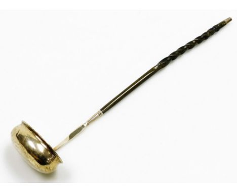 A crested toddy ladle, with twisted whale bone handle, bears no marks, 34.5cm long.
