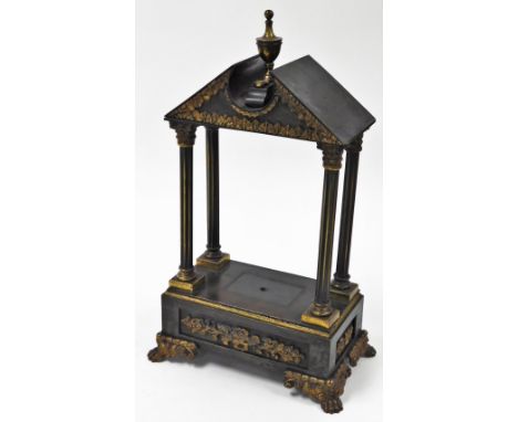 A French style cast metal mantel clock case, with applied floral detailing, on four columned supports, on paw feet, 46cm high