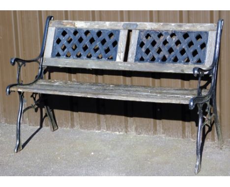 A cast iron and wooden slatted garden bench, with pierced slat with plaque Steven Joyce Mum and Dad, thinking of you, painted
