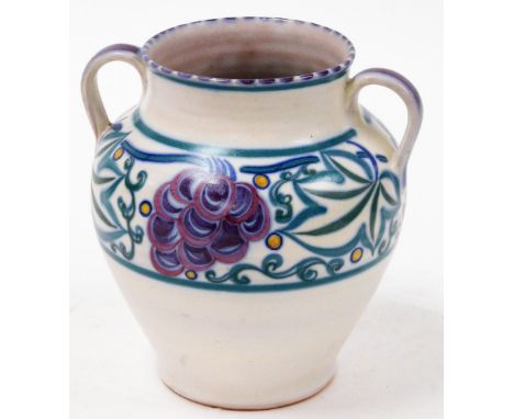 A Poole pottery vase, with green and purple design, with two ring handles, 20cm high.