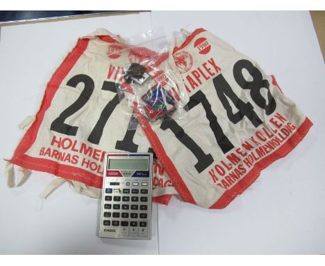 Skiing, Holmenkollen Competitors Breast Plate, fabric number bibs '2711' for 1979 and '1748 for 1980. Two related enamel lape