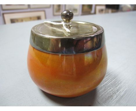 A Moorcroft Preserve Jar, orange lustre with electroplated rim and lid, ball finial, impressed marks to base.