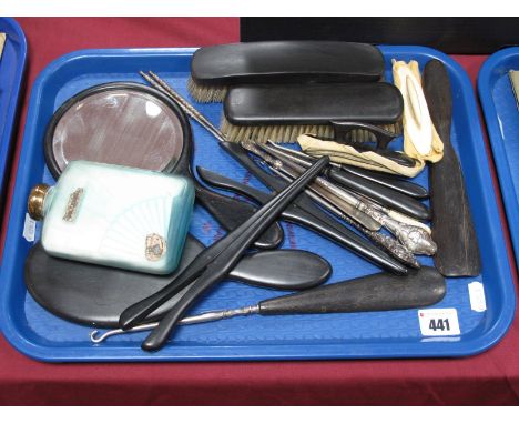 Ebony Dressing Table Items, handmirror, gloves stretchers, button hooks, brushes, together with Art Deco glass table bottles,