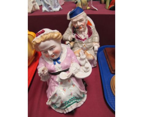 Pair of German Pottery Tobacco Jars, late circa XIX Century, one as a pipe smoking gentleman, the other as a lady drinking te