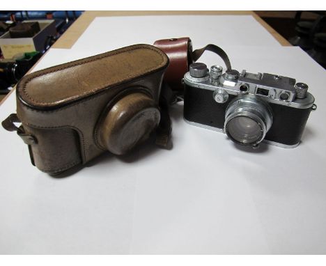 A 1939 Leica 35mm Camera, model IIIa, E. Leitz g.m.b.h. Germany, body serial no. 310312, Summar 5cm fl.2 lens no. 368747, in 