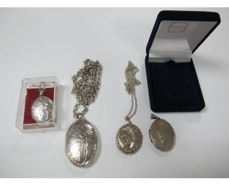 A Large Oval Locket Pendant, stamped "Thailand 925", on a chain, together with three further locket pendants. 