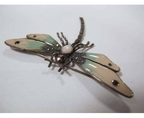 An Art Deco Style Dragonfly Brooch, oval cabochon set to the centre, between enamel and marcasite set wings, stamped "925". 