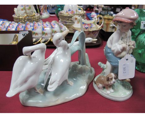 Lladro Figure Group of Ducks, Lladro figure of a boy and a dog. (2) 