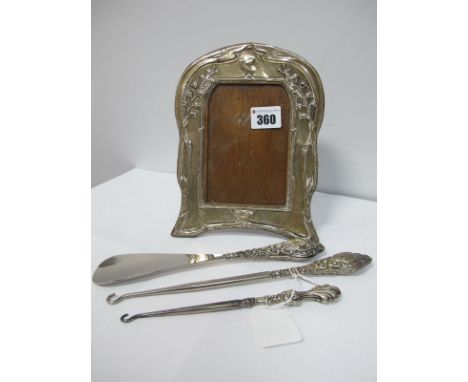 A Hallmarked Silver Mounted Wooden Photograph Frame, (damages) on easel back; together with two button hooks and a shoe horn.