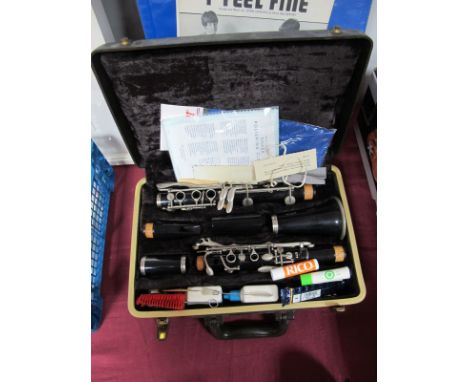 A Bundy Five Section Clarinet, in plush lined hard protective carry case, with accessories. 