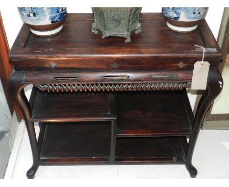 A 19th Chinese side table, having a three-tier shelf below a carved and pierced border, raised on cabriole legs. H.76cm W.86c