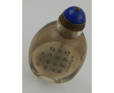 A Chinese glass snuff bottle, intaglio decorated with portrait and Chinese character to back. H.7cm