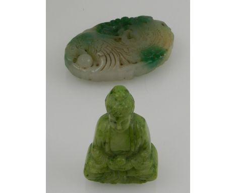 A Chinese miniature jade carving of Buddha, together with a Chinese jade pendant, carved with a phoenix and a flaming pearl t
