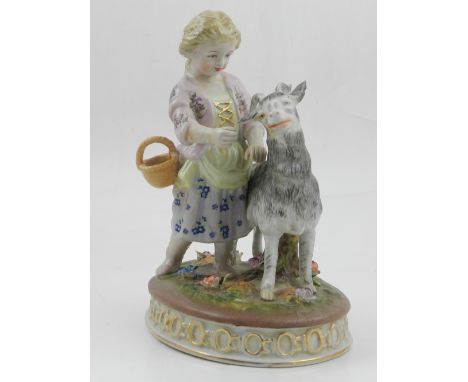 A ceramic figure of a little girl and a goat, in the 19th century style. 