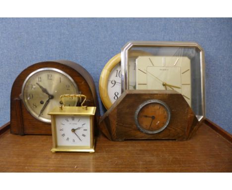 A collection of clocks, barometers and a cased thermometer 