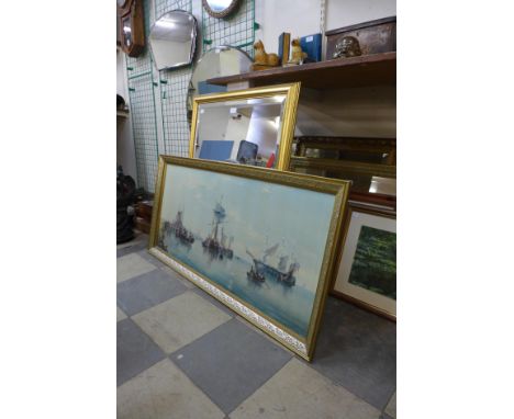 A gilt framed mirror and a marine scene print 