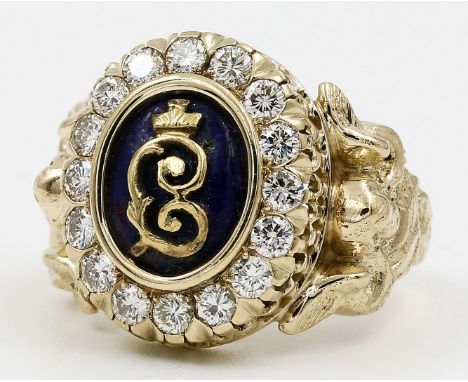 König-Ludwig-Ring. 585/000 GG, brutto 16,7 g. Reich reliefierte Ringschiene, am Ansatz des Kopfes je geflügelter Puttokopf. M