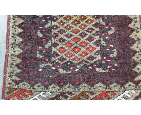 VINTAGE 'BOTEH' RUNNER, with geometric designs, on a red ground154cm long, 51cm wide