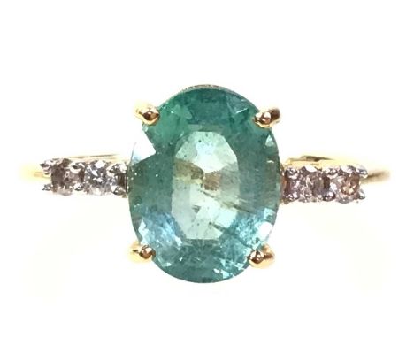 GEMSTONE AND DIAMOND RING, IN EIGHTEEN CARAT GOLD  the green/blue oval stone flanked by diamond set shouldersQty: 3.35g