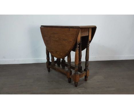 OAK OVAL GATE LEG TABLE, on turned supports73cm high, 74.5cm wide