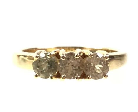 GEMSET THREE STONE RING, IN EIGHTEEN CARAT GOLD  set with a row of yellow tinted round stonesQty: 4.45g