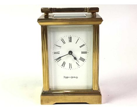 BRASS CARRIAGE CLOCK, MAKER MAPPIN & WEBB with Roman numerals, raised on bracket feet, boxed11cm high 