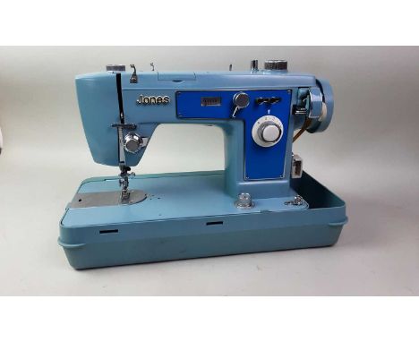 JONES SEWING MACHINE, in caseitem has not been tested, some minor stains and scratches to the frame of the sewing machine how