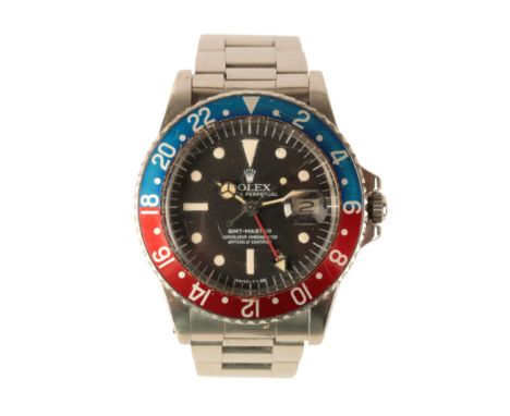 A ROLEX OYSTER PERPETUAL GMT- MASTER GENTLEMAN'S STAINLESS STEEL BRACELET WATCH, with automatic movement, the black dial with