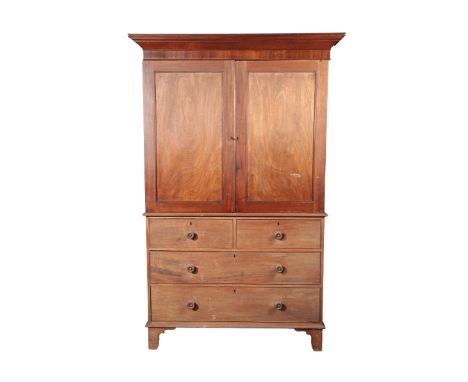 A VICTORIAN MAHOGANY LINEN PRESS, the top section with a moulded cornice above recessed panel doors, the bottom section with 