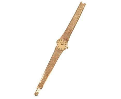 AN OMEGA 9CT GOLD LADY'S BRACELET WATCH, with manual wind movement, the gold dial with gold batten numerals and dark blue ste