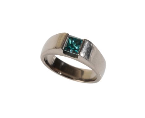 A TREATED BLUE DIAMOND SOLITAIRE RING, the princess-cut diamond measures approx. 0.63cts in a tension setting, the titanium s