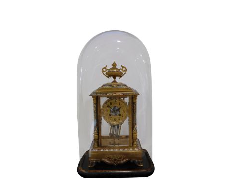A FRENCH GILT BRASS AND CHAMPLEVE ENAMEL MANTLE CLOCK, the 10cm round dial with Arabic numerals, the two train movement strik